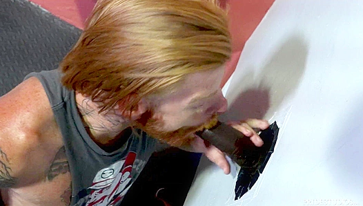 Tattooed Ginger Moans as Huge BBC Slams His Throat at Glory Hole – Steamy Interracial