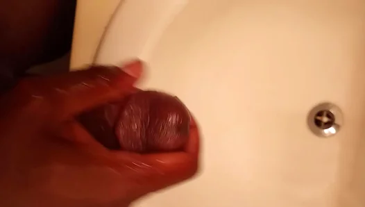 Big ebony stud strokes his thick cock hard until cum erupts—hot solo session